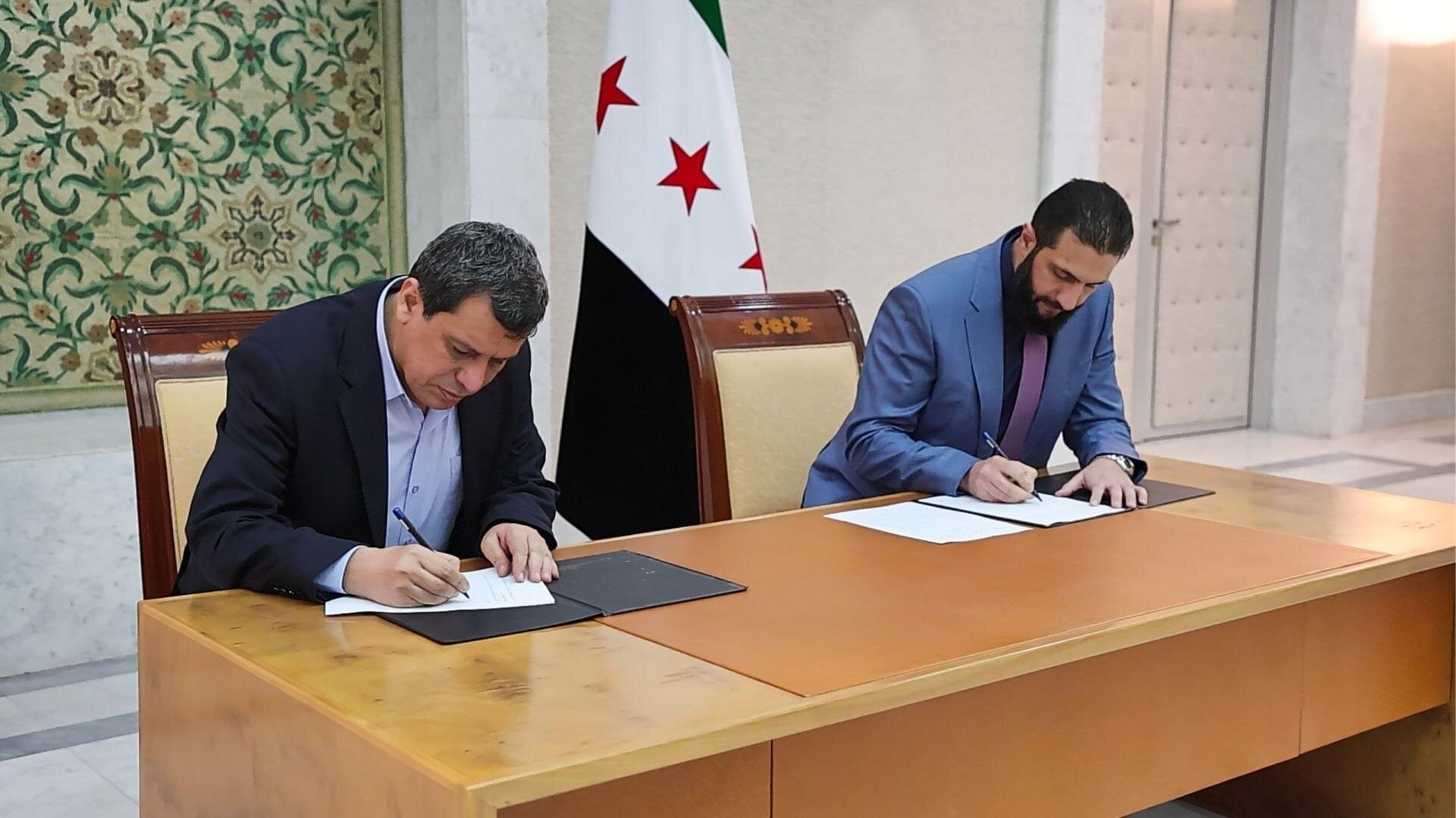 Syria's president signs deal with Kurdish-led SDF