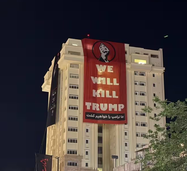 Anti-Trump banner displayed on hotel building in Mashhad