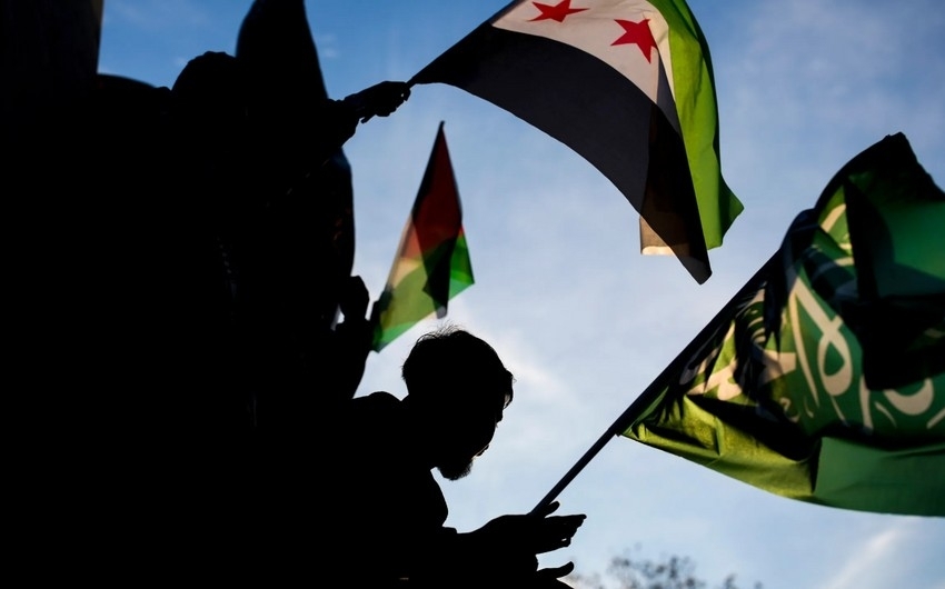 Syrian opposition leader calls for 18 month transition period before elections